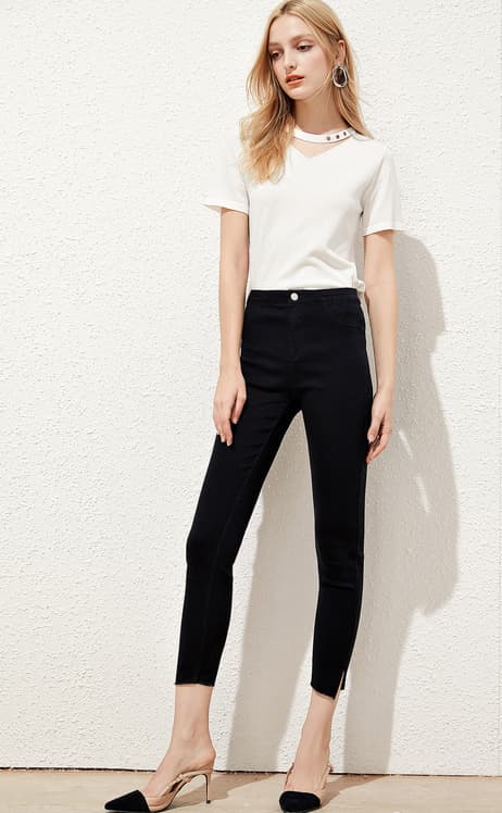 White trim detail crew-neck knit tee styled with black pants