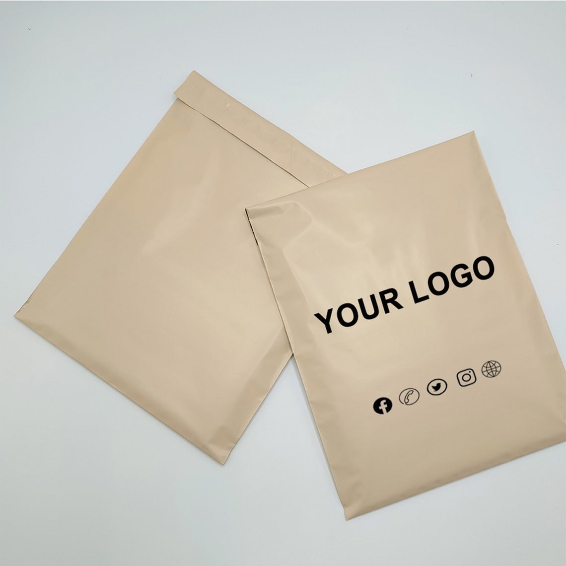 Paper garment mailers with a placeholder logo, illustrating the individual packaging version to reconfirm for a repeat order
