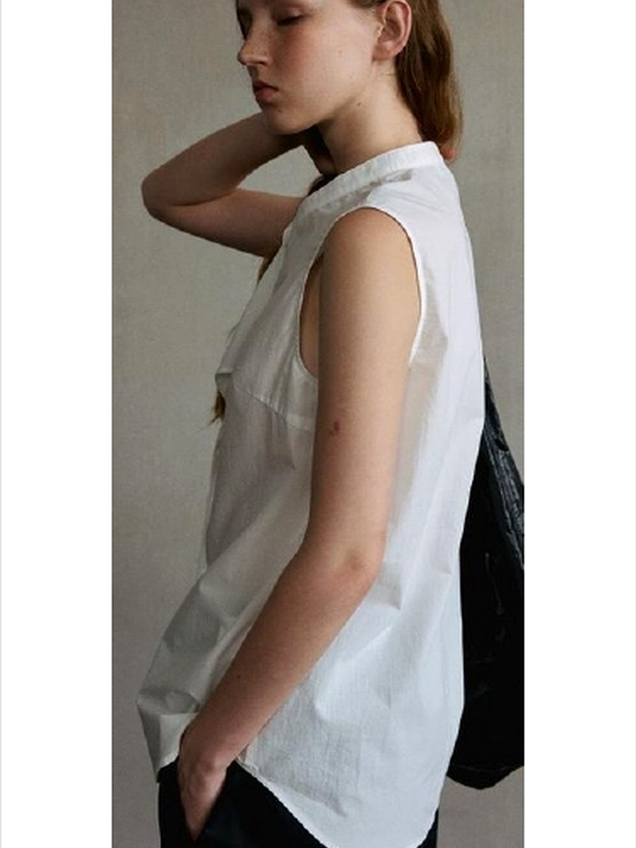 Sleeveless Cotton Wrap Blouse product photo from Yinshan Blouse Collection 2026