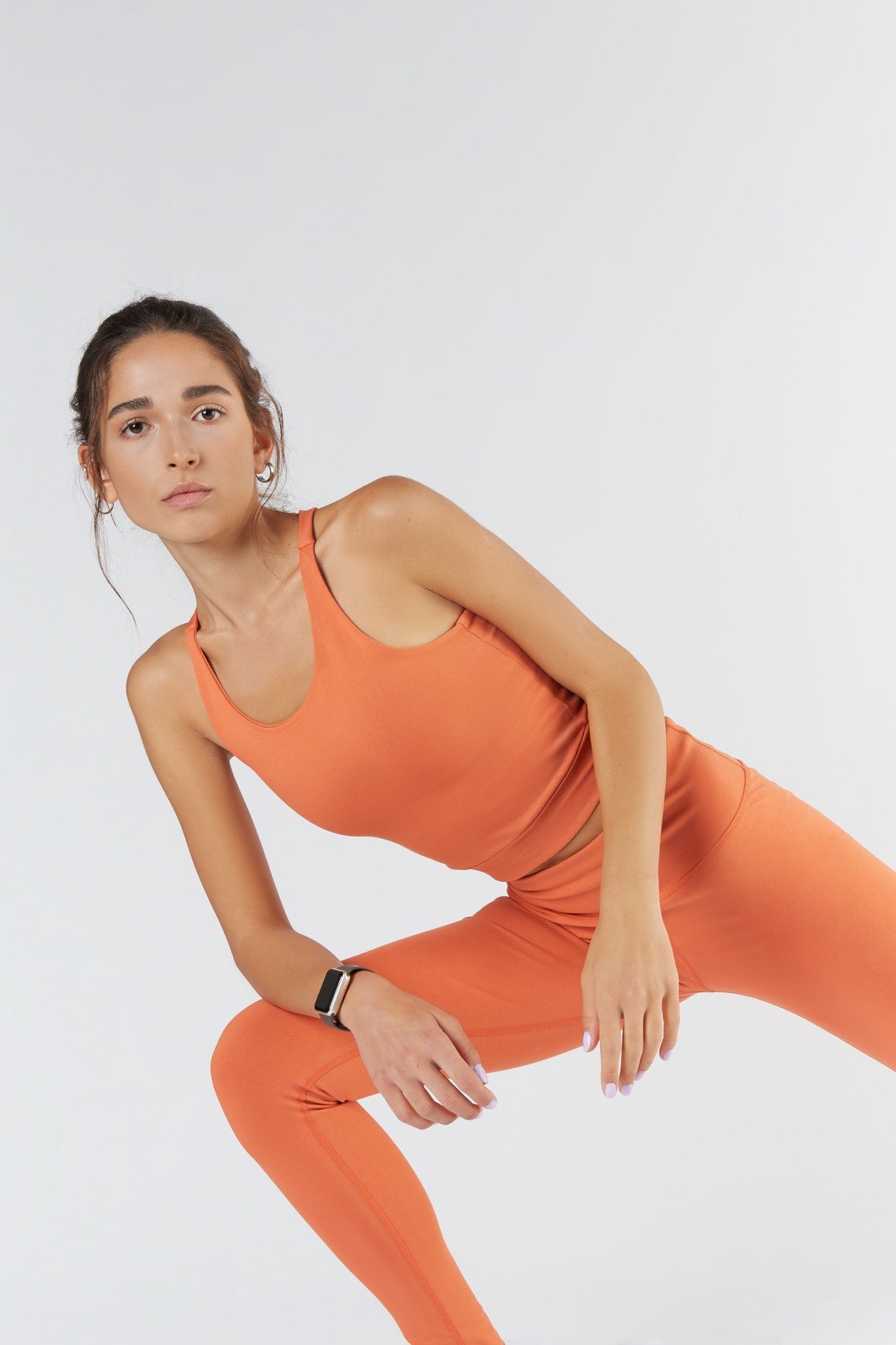 Organic cotton fashion top detail in warm orange, supplied by the Yinshan Fashion image library