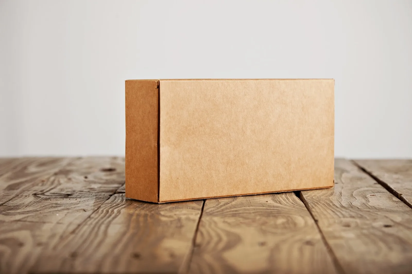 A closed corrugated carton illustrating the final outer packaging that must match the warehouse receiving instructions
