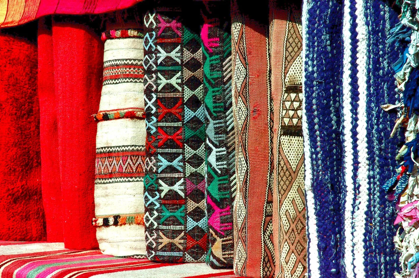 Traditional woven patterned textiles shown as a comparison with surface-printed fashion fabric