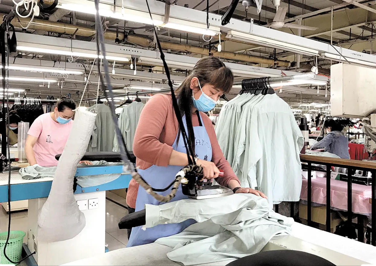 Yinshan Fashion production team preparing garments during finishing and packing work