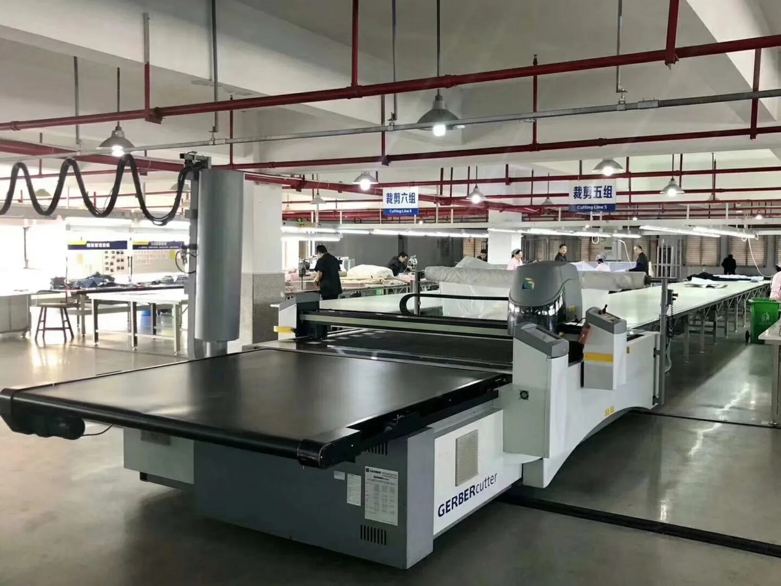 Yinshan Fashion cutting area where approved pattern and material decisions move toward controlled bulk cutting