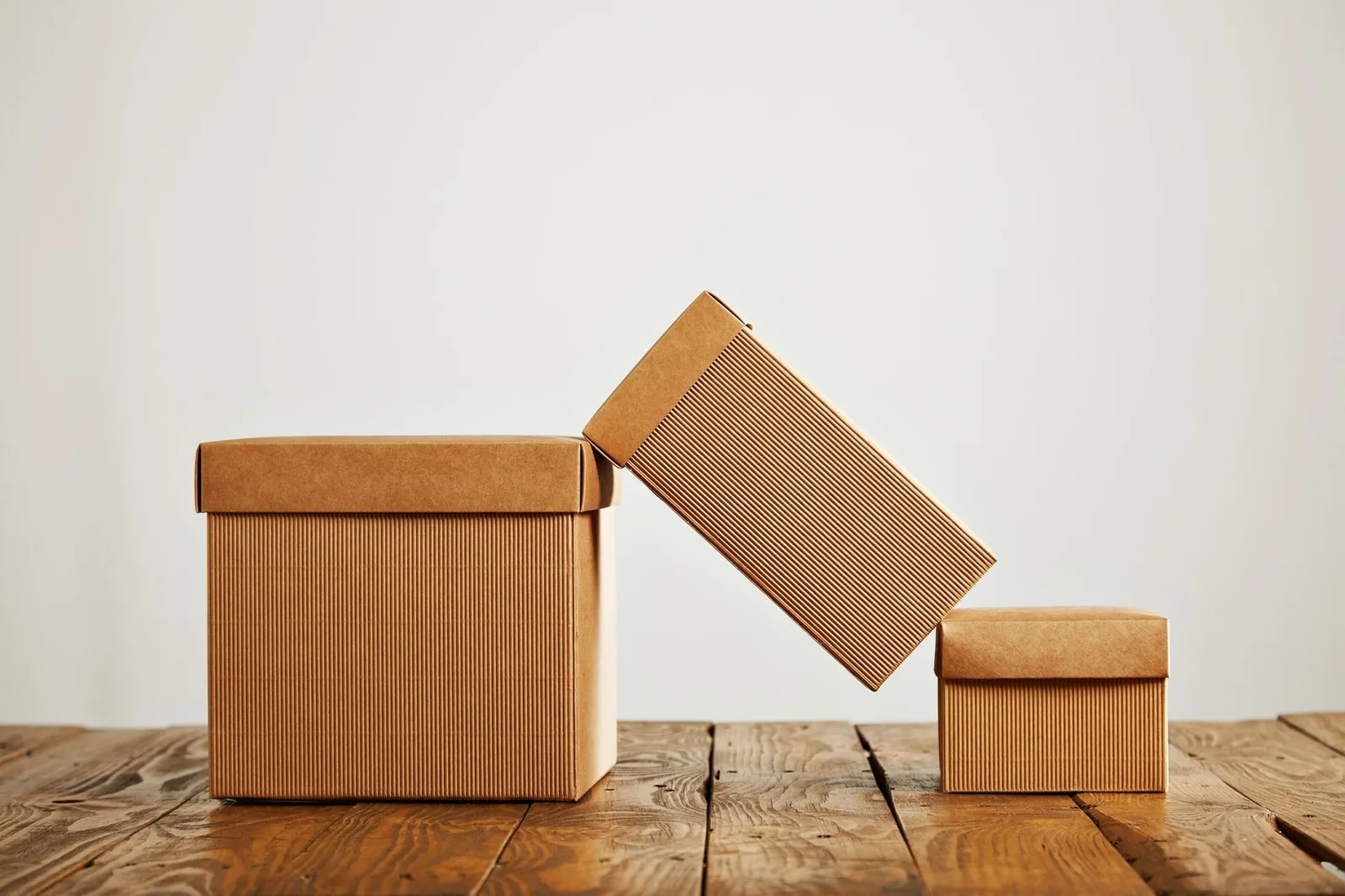 Cardboard cartons in different sizes, used as a packing-specification reference before releasing a first bulk shipment