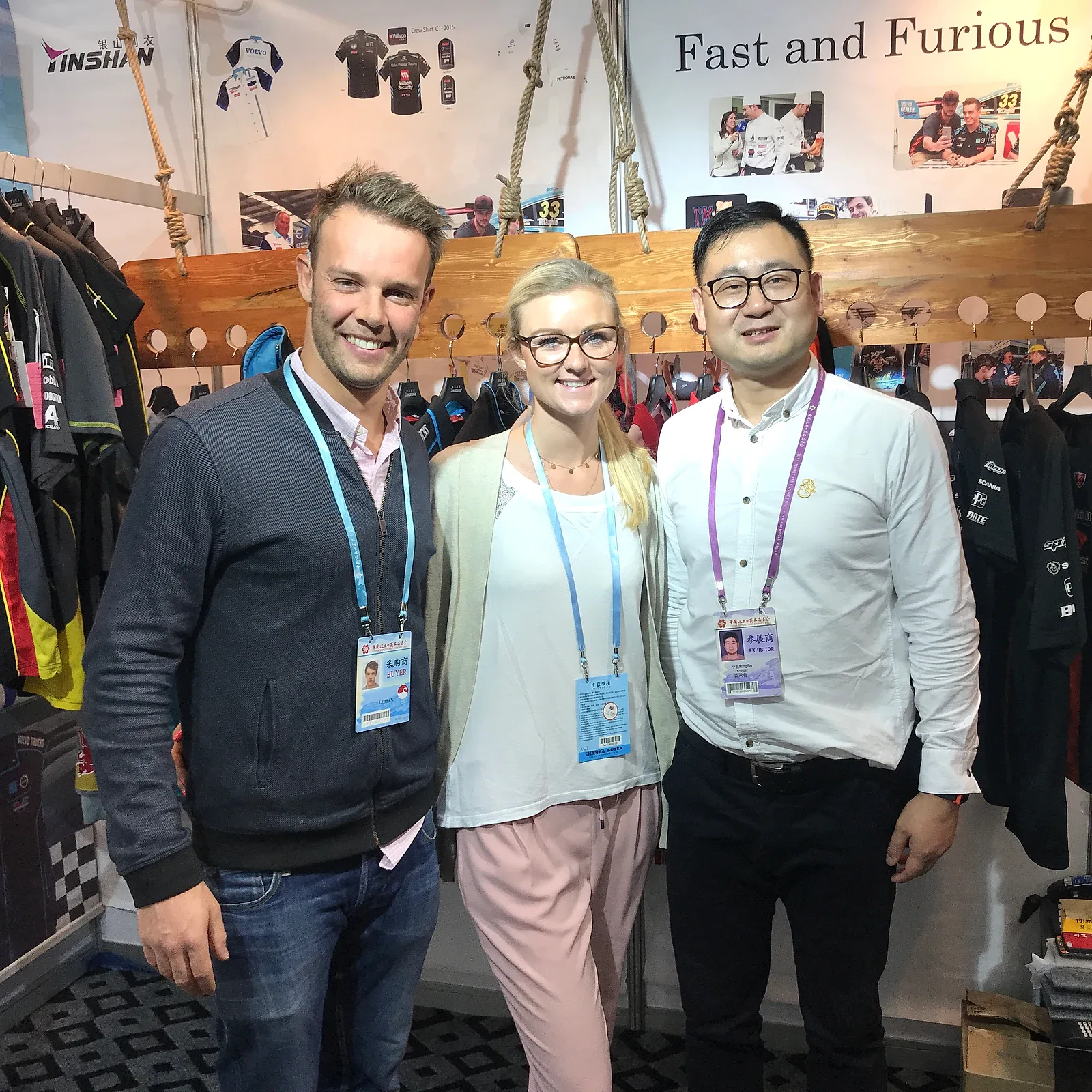 Yinshan Fashion team meeting international apparel buyers at a trade show
