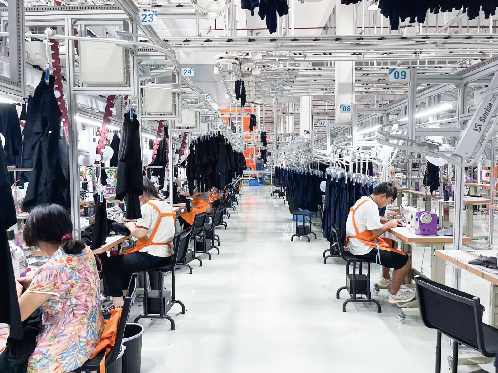 Yinshan garment production team working on the hanging-line factory floor